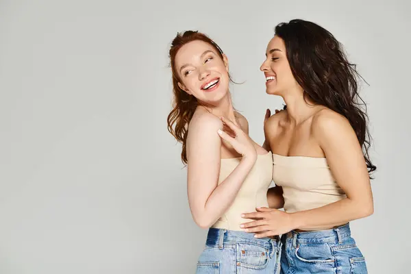 Two elegant women embrace each other, radiating happiness and love. — Stock Photo