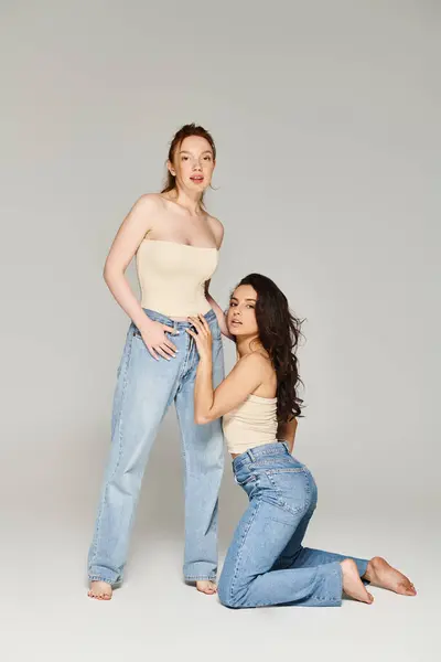 Two elegant women, a loving lesbian couple, happily pose together. — Stock Photo