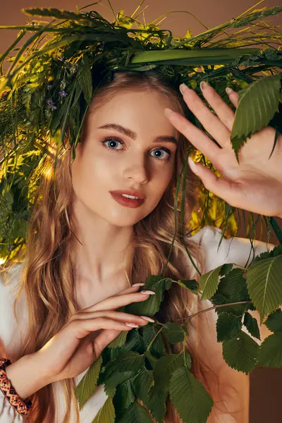 A young woman wearing a traditional outfit adorned with a wreath of leaves, radiating beauty in a fairy and fantasy setting. — Stock Photo