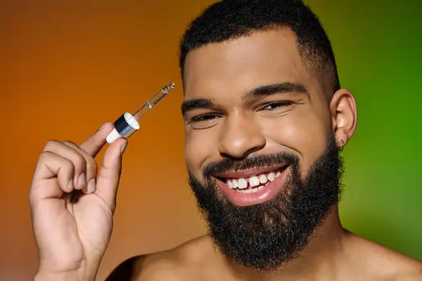 African american young man holds serum. — Stock Photo