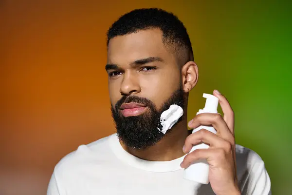 African american good looking man using shaving cream. — Stock Photo