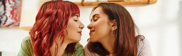 Happy lesbian couple going to kiss each other while having cozy and sweet moment at home, banner — Photo de stock