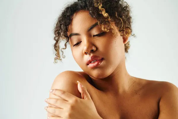 African American woman gently posing in a peaceful gesture. — Stock Photo