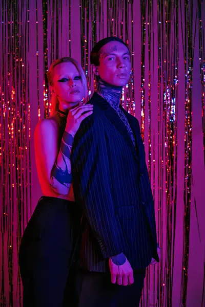 A man and a woman standing side by side at a rave-party — Stock Photo