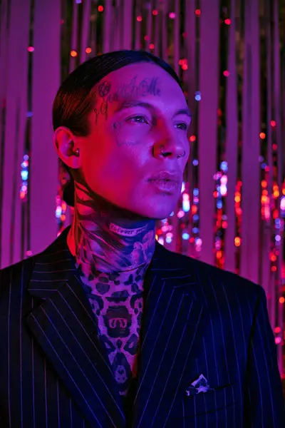 Man with neck tattoos wearing a suit — Stock Photo