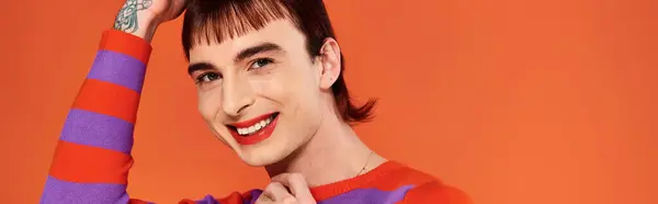 Jolly attractive stylish gay man with vibrant makeup in modish casual outfit, pride month, banner — Stock Photo
