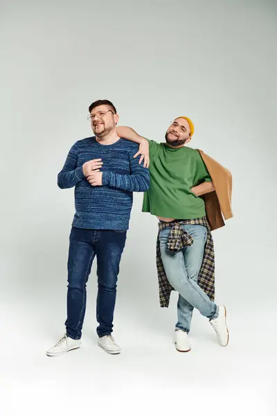 Two men stand with arms around each other, showing love and closeness. — Stock Photo
