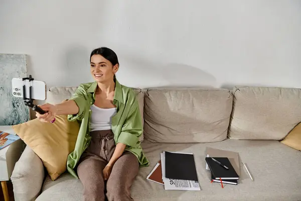 Casual, remote worker relaxing on couch with phone. — Stock Photo