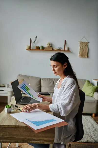 Woman working on laptop at table. — Stock Photo