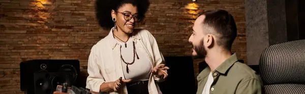 Two musicians engaged in a conversation during a band rehearsal in a recording studio. — Stock Photo