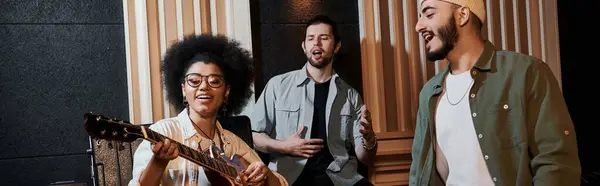 A music band rehearses in a recording studio — Stock Photo