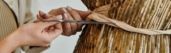 Woman in casual attire upcycling fabric with scissors. — Stock Photo