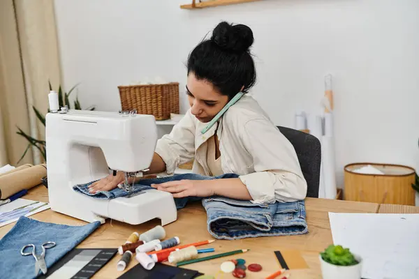Young woman in casual attire upcycling clothes with a sewing machine. — Stock Photo