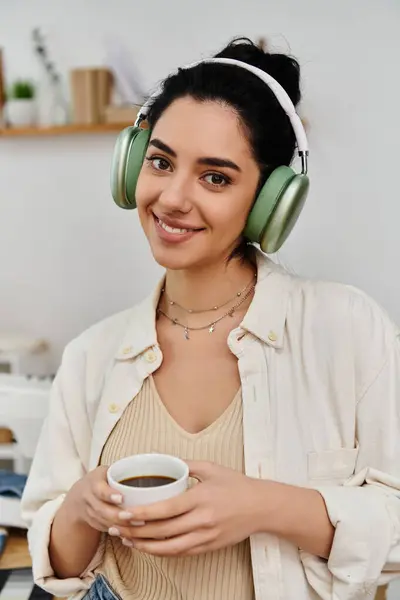 Woman in headphones enjoying coffee. — Stock Photo