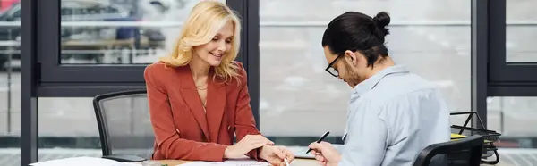 Two women engaged in a deep conversation at a desk. — Stock Photo