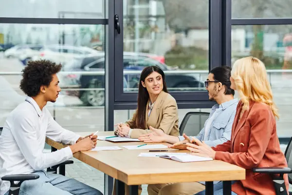 Job seekers actively engaging in a job interview at an office table. — Stock Photo