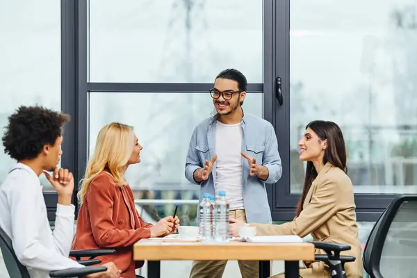 Professionals engage in a lively meeting at an office table. — Stock Photo