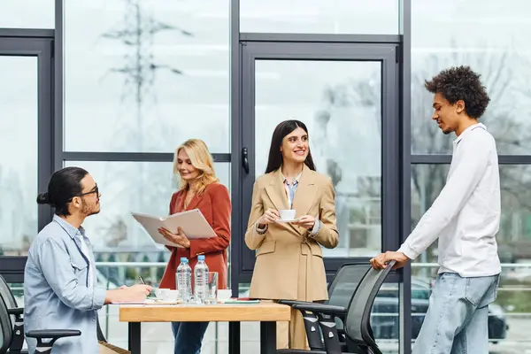 People sitting around a table in an office engaged in a productive discussion. — Stock Photo