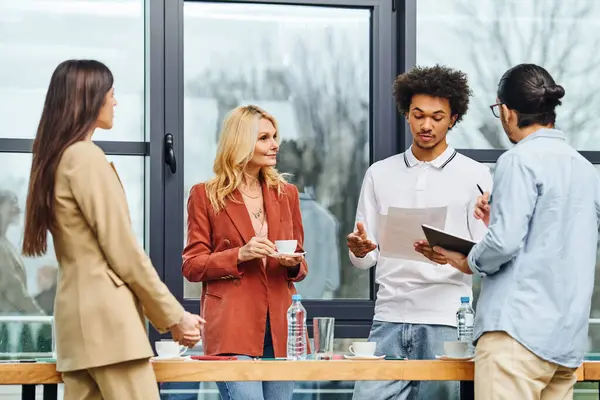 Group of job seekers engaged in a collaborative discussion around a table in an office. — Stock Photo
