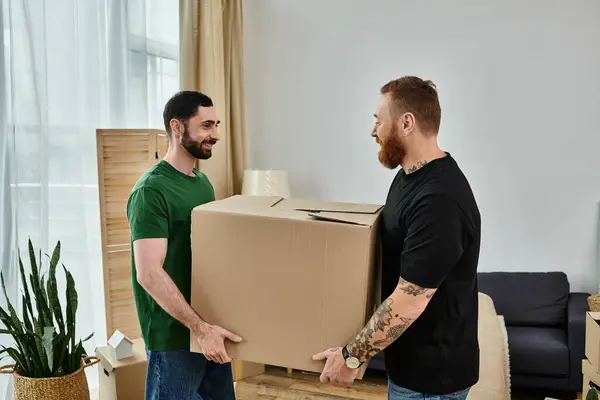 A loving gay couple stands together in a new living room surrounded by moving boxes, starting a new chapter. — Stock Photo
