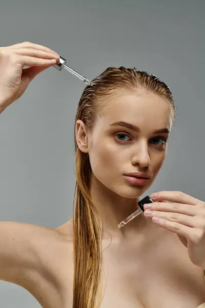 Young, beautiful woman delicately taking care of her hair. — Stock Photo