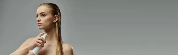 Alluring woman applying hair treatment. — Stock Photo