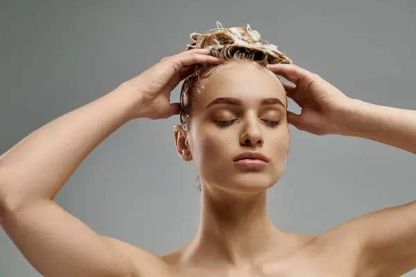 A young woman confidently displays her hair care routine with wet hair, showcasing a transformative moment. — Stock Photo