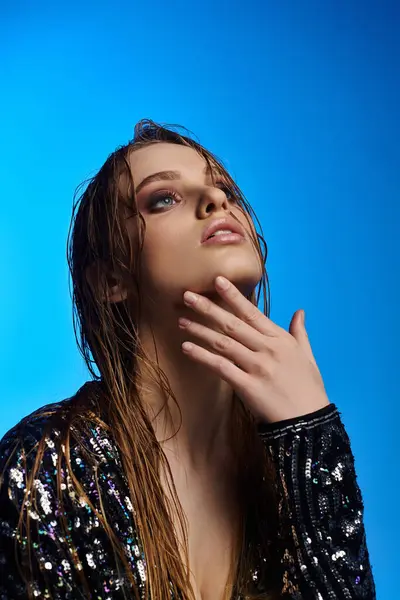 A stunning woman flaunting long hair in a sparkling sequin jacket. — Stock Photo