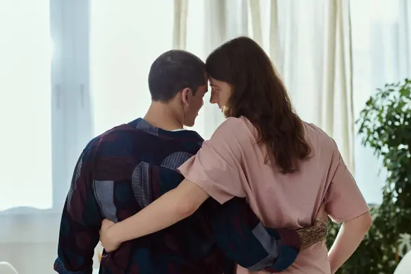 A gay couple, dressed casually, standing side by side in a moment of connection and love. — Stock Photo