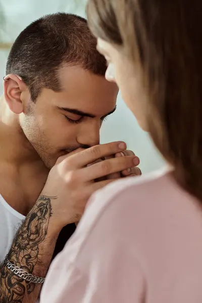 An intimate moment of gay couple at home, expressing admiration and affection. — Stock Photo