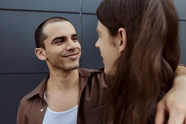 A gay couple in casual clothes standing next to each other outdoors, showcasing love and togetherness. — Stock Photo