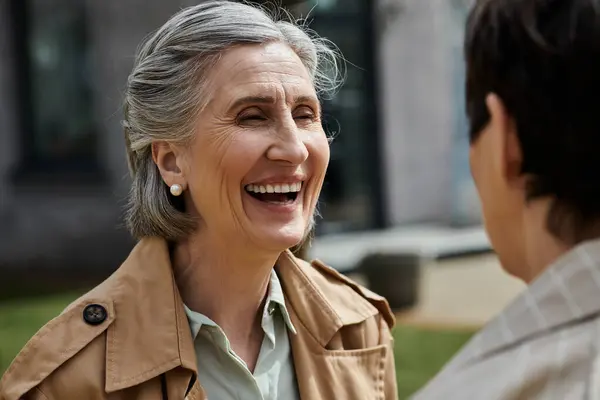 Two women smiling at each other. — Stock Photo