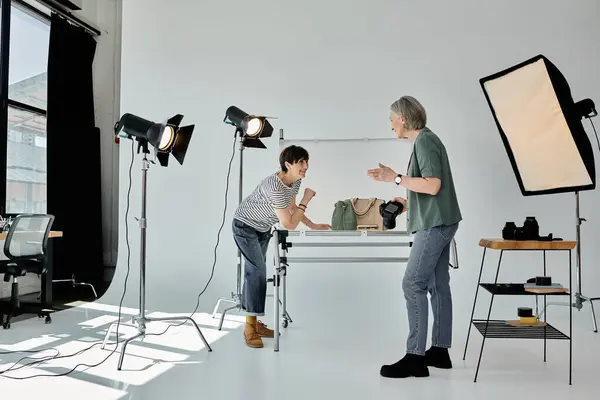 Women creating fashion photo content in professional studio — Stock Photo