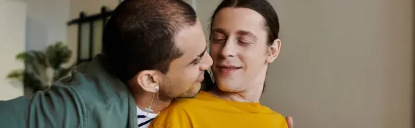 A young gay couple enjoys a moment of intimacy and connection in their modern apartment. — Stock Photo
