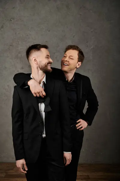 Two men in elegant suits share a loving gaze, reflecting deep affection for each other. — Stock Photo