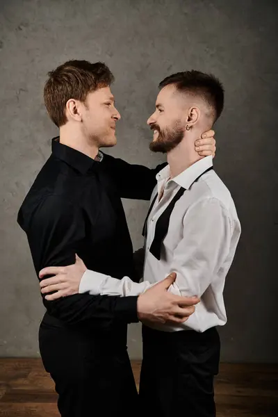 Two men in elegant suits embrace and share a loving gaze. — Stock Photo