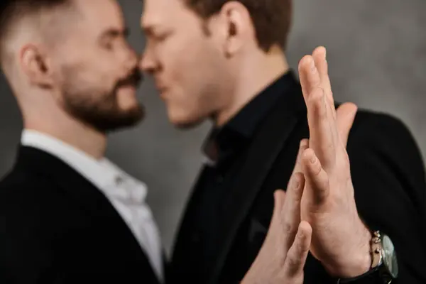 Two men in suits stand close, their faces close together. — Stock Photo