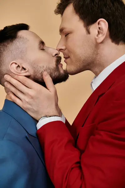A close-up photograph of two men in suits, sharing a tender moment together. — Stock Photo