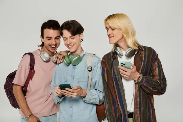 Three young students, part of the queer community, pose together in a studio setting. — Stock Photo