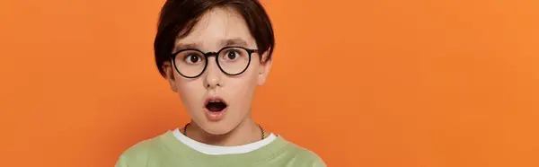A young boy looks surprised while at home with his friends. — Stock Photo