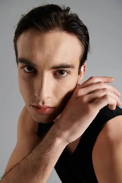 A close-up portrait of a young man, his eyes intense and captivating. — Stock Photo