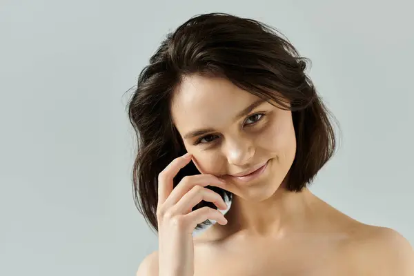 A close-up portrait of a beautiful woman smiling with a vibrant backdrop. — Stock Photo