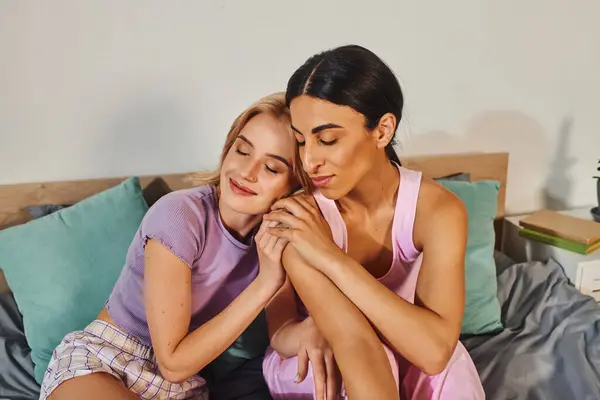 A happy lesbian couple is enjoying a moment of intimacy and affection in their comfortable home. — Stock Photo
