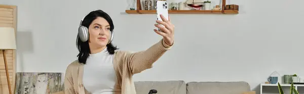 A woman in a wheelchair takes a selfie with a bright smile. — Stock Photo