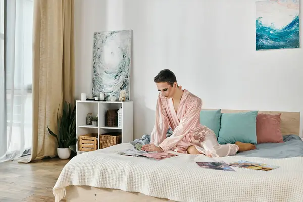 A vibrant drag queen explores fashion magazines in a stylish bedroom. — Stock Photo