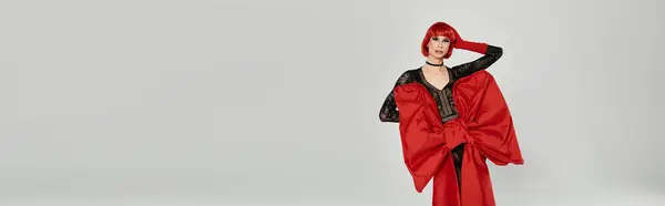 A vibrant drag queen showcases elegant fashion and confident expression. — Stock Photo