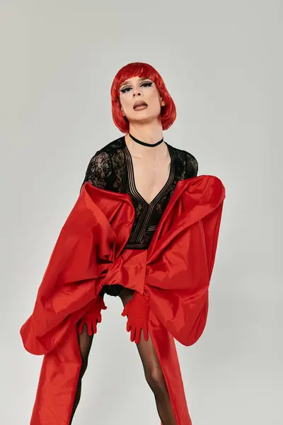 A stunning drag queen showcases vibrant fashion and confident expression. — Stock Photo