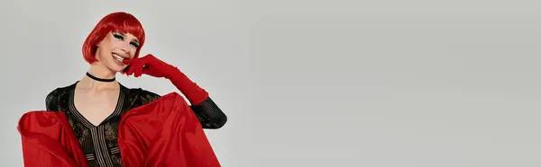 Attractive drag queen showcases glamour with bold colors and captivating pose. — Stock Photo
