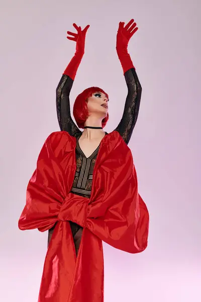 A stunning drag queen strikes a dynamic pose, showcasing vibrant colors and charisma. — Stock Photo