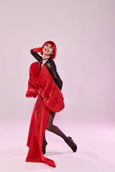 An attractive drag queen showcases playful elegance and confidence in a striking pose. — Stock Photo